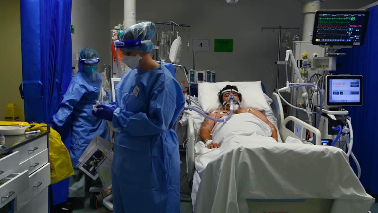 ICU staff caring for a COVID-19 patient at St Vincent’s Hospital in Sydney, Tuesday, July 13, 2021