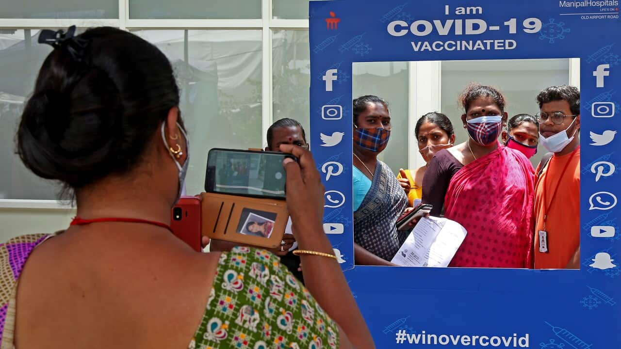 Members of India's LGBTIQ+community pose for a photo after receiving the vaccine shot in Bangalore.