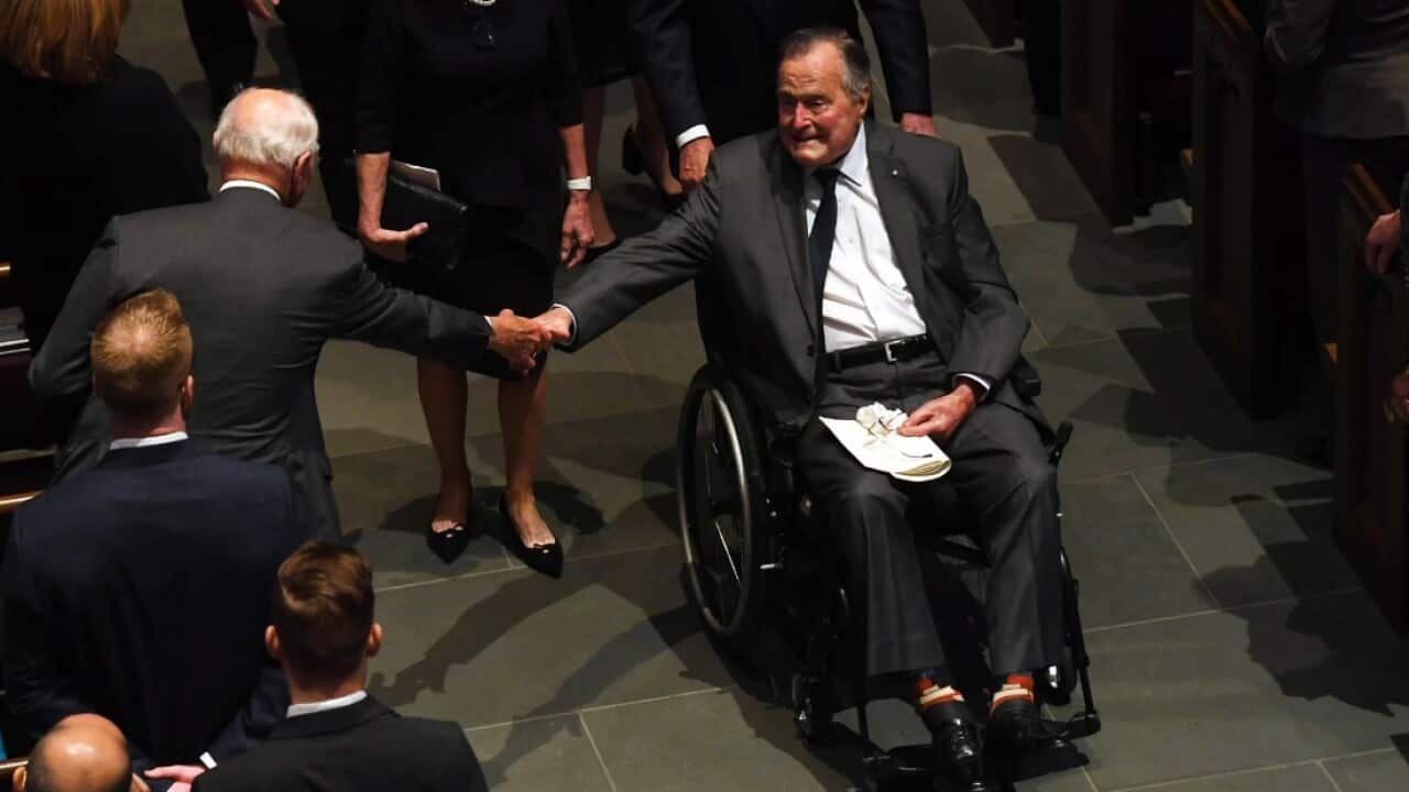 Former US President George H.W. Bush exits the funeral of his wife Barbara Bush