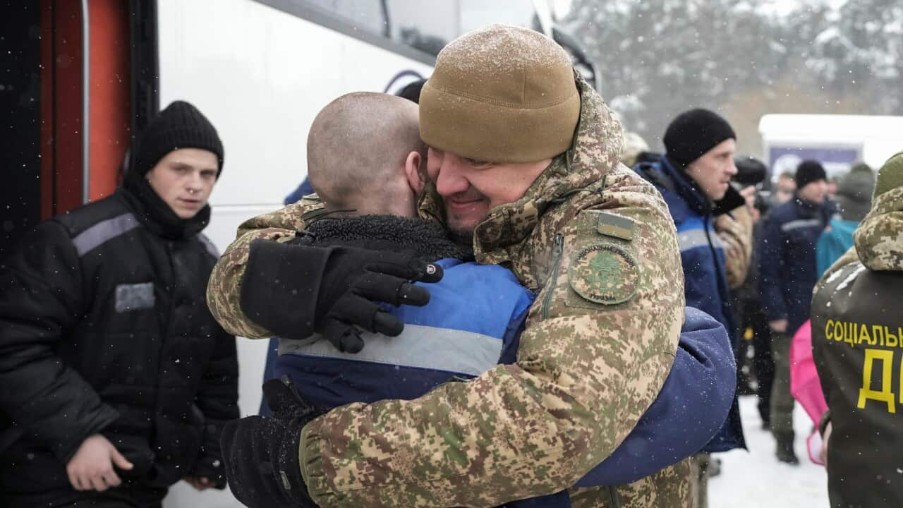 Ukrainian prisoners of war (POWs) react following a prisoner swap