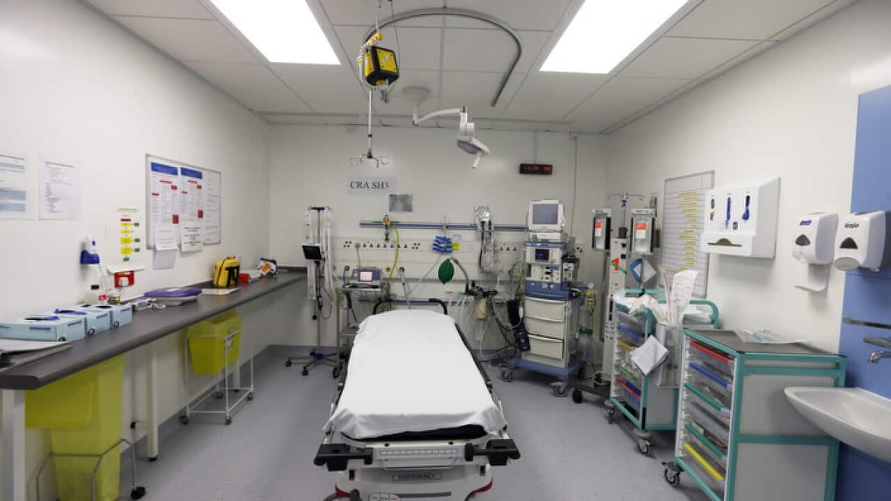A hospital bed with medical equipment