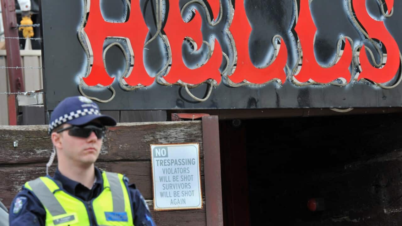 Police stand guard outside a Hells Angels fortified club in Melbourne