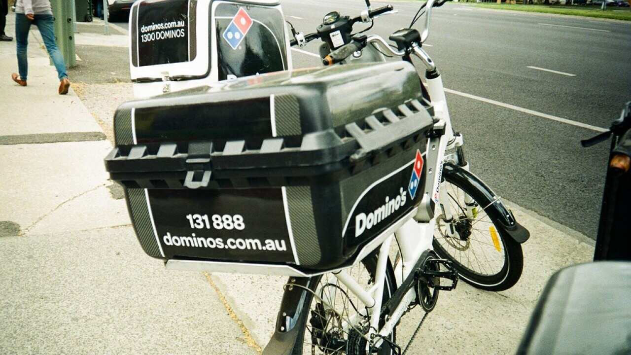 Pizza delivery bike. Food deliverers use different modes of transport.