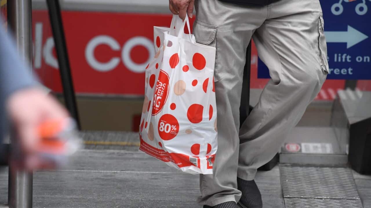 A shopper is seen carrying a reusable plastic bag at a Coles Sydney CBD store, Sydney, Monday, July 2, 2018.