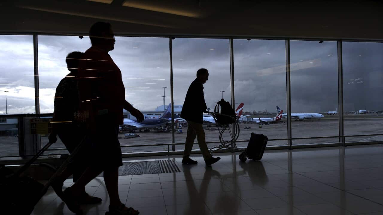 Tourists at the international airport in Sydney, Monday, April 1, 2013. (AAP Image/Paul Miller) NO ARCHIVING, EDITORIAL USE ONLY