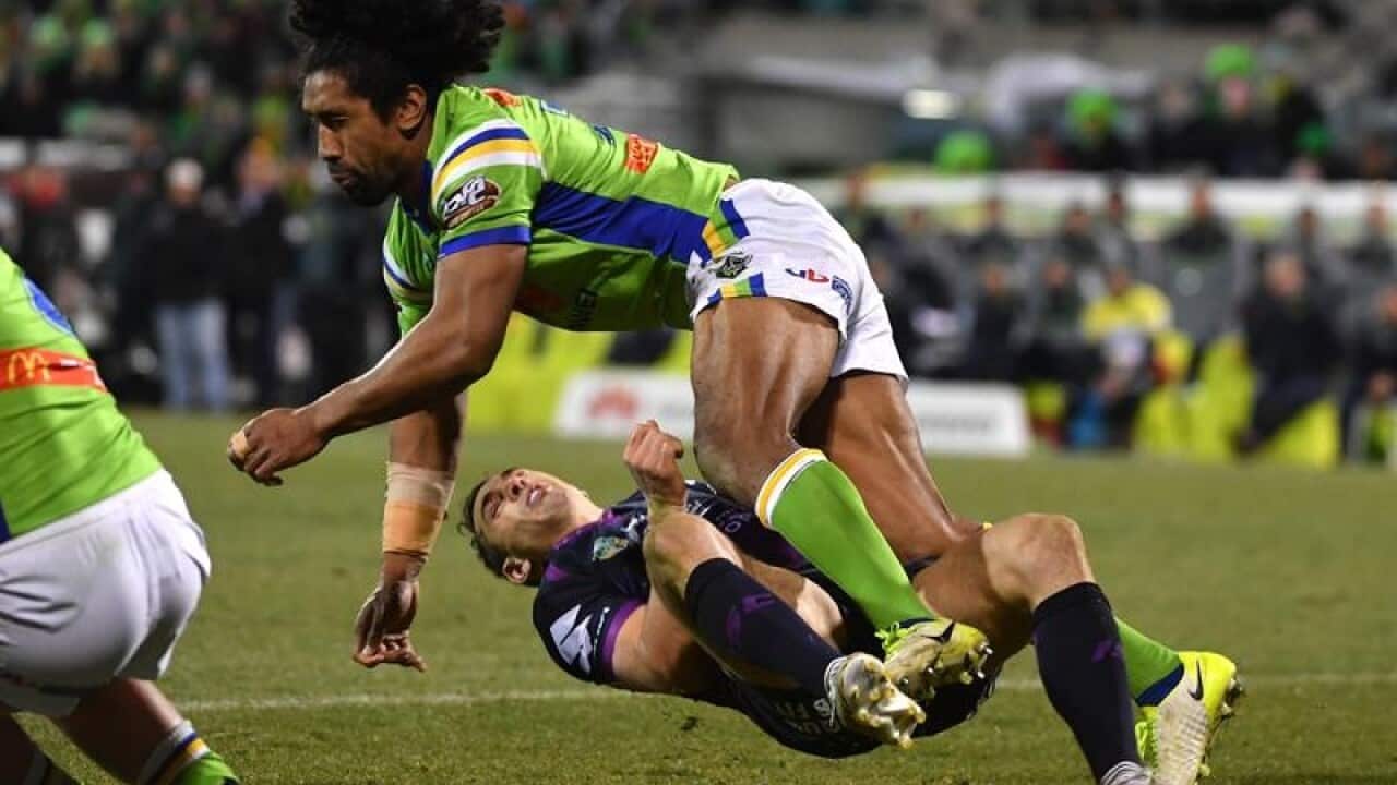 Billy Slater of the Storm is knocked out by Iosia Soliola