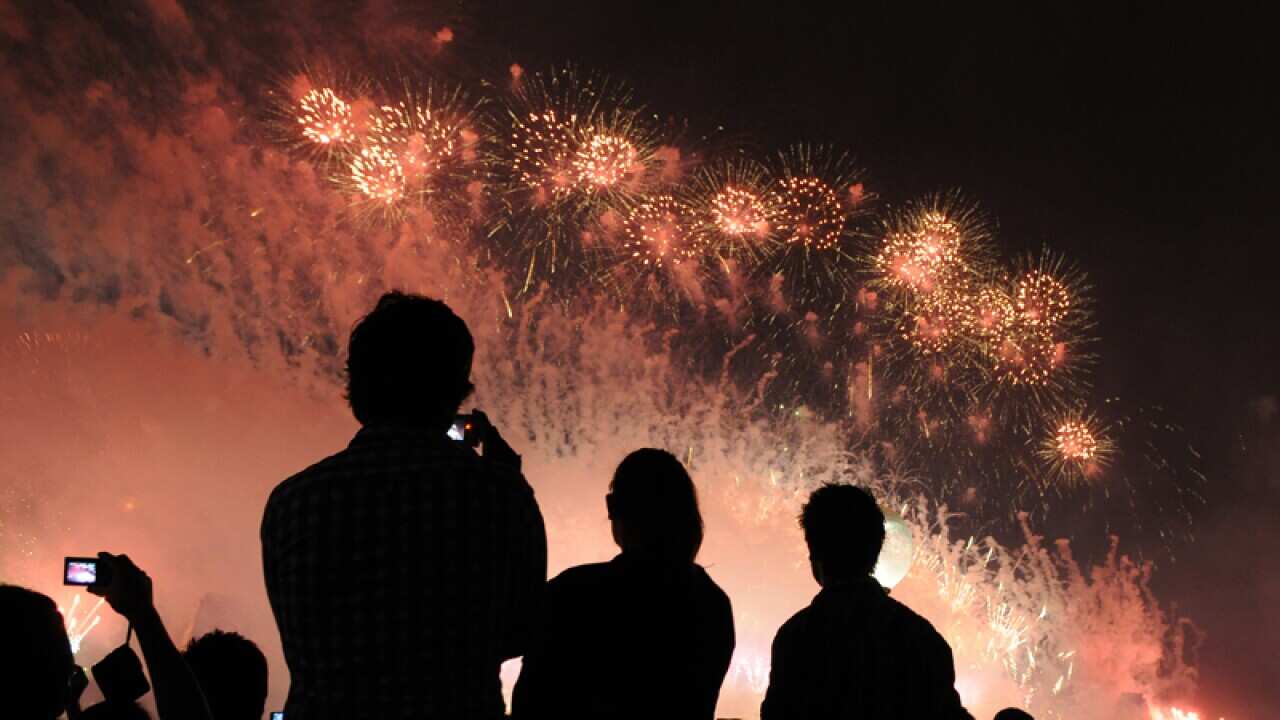 People watch the fireworks at Sydney's harbour bridge