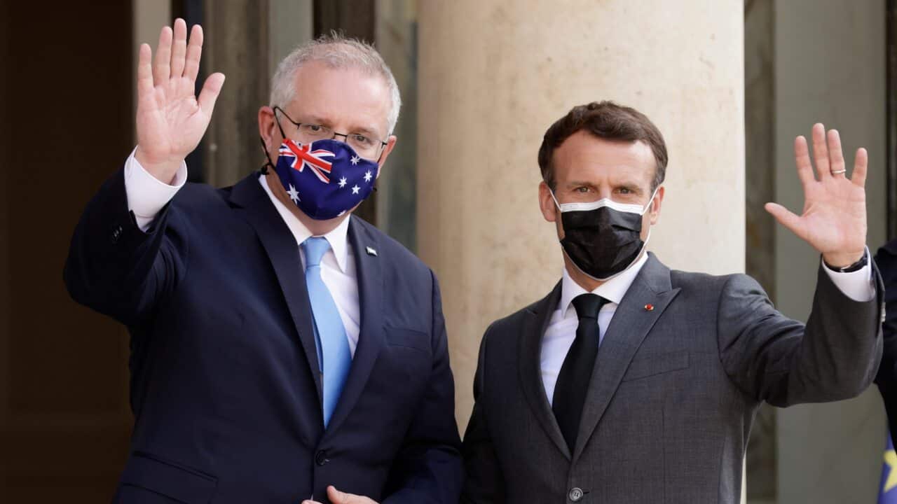 French President Emmanuel Macron greets Australian Prime Minister Scott Morrison upon his arrival at the Elysee Palace in Paris in June.