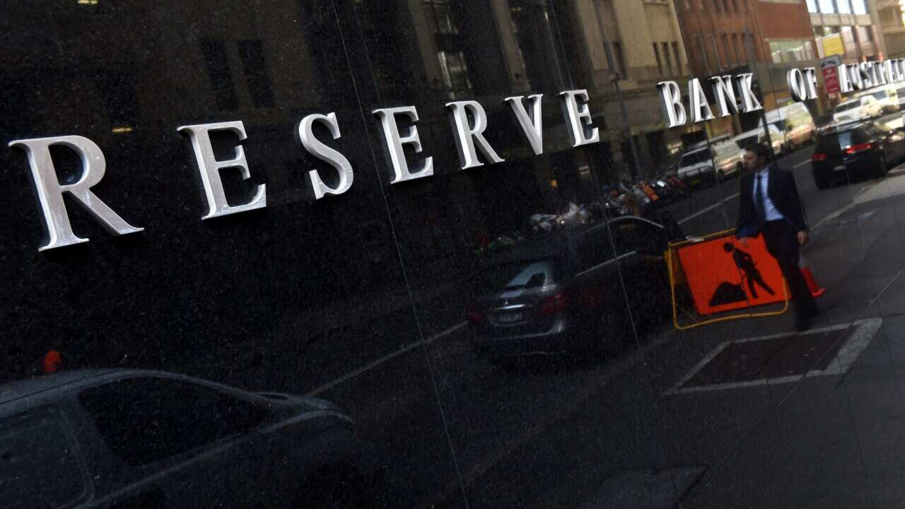 People walk past the Reserve Bank of Australia (RBA) in Sydney, Tuesday, April 6, 2016. The RBA is expected to leave interest rates on hold today. (AAP Image/Dean Lewins) NO ARCHIVING