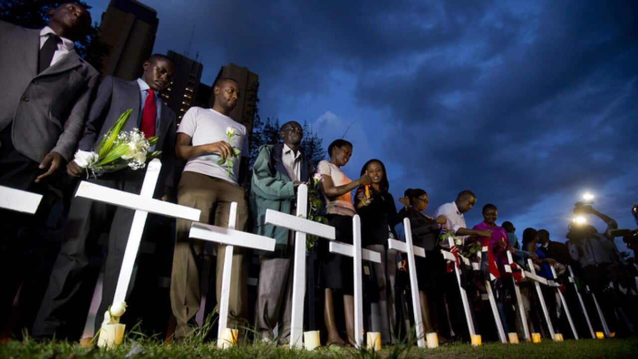 kenyans_light_candles_next_to_white_wooden_crosses_for_each_of_the_victims_of_the_garissa_attack_-_aap-001.jpg