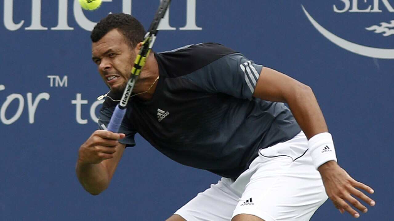 Jo-Wilfried Tsonga returns the ball.
