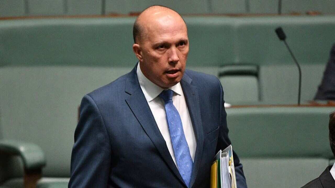 Minister for Home Affairs Peter Dutton leaves Question Time in the House of Representatives.