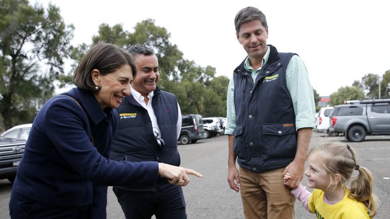 NSW Premier Gladys Berejiklian speaks with Nationals candidate Dave Layzell's daughter Ashley on polling day in Muswellbrook on Saturday, 22 May.