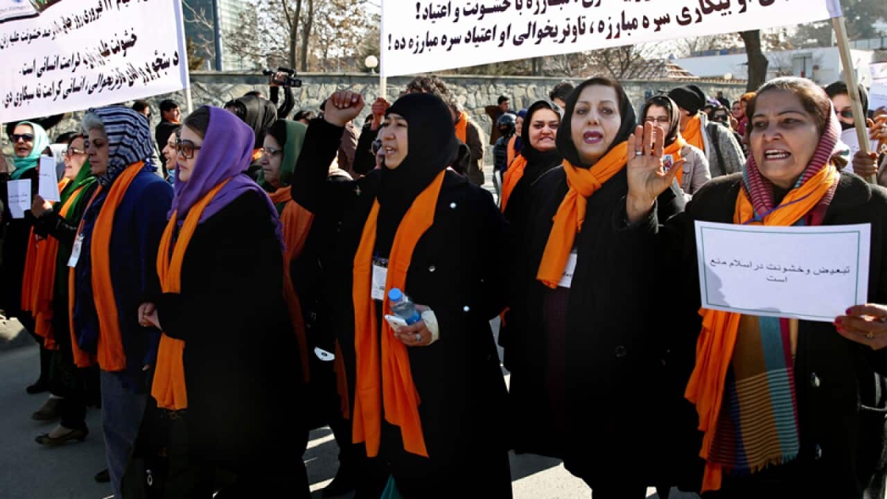 Afghan women chant slogans during a demonstration