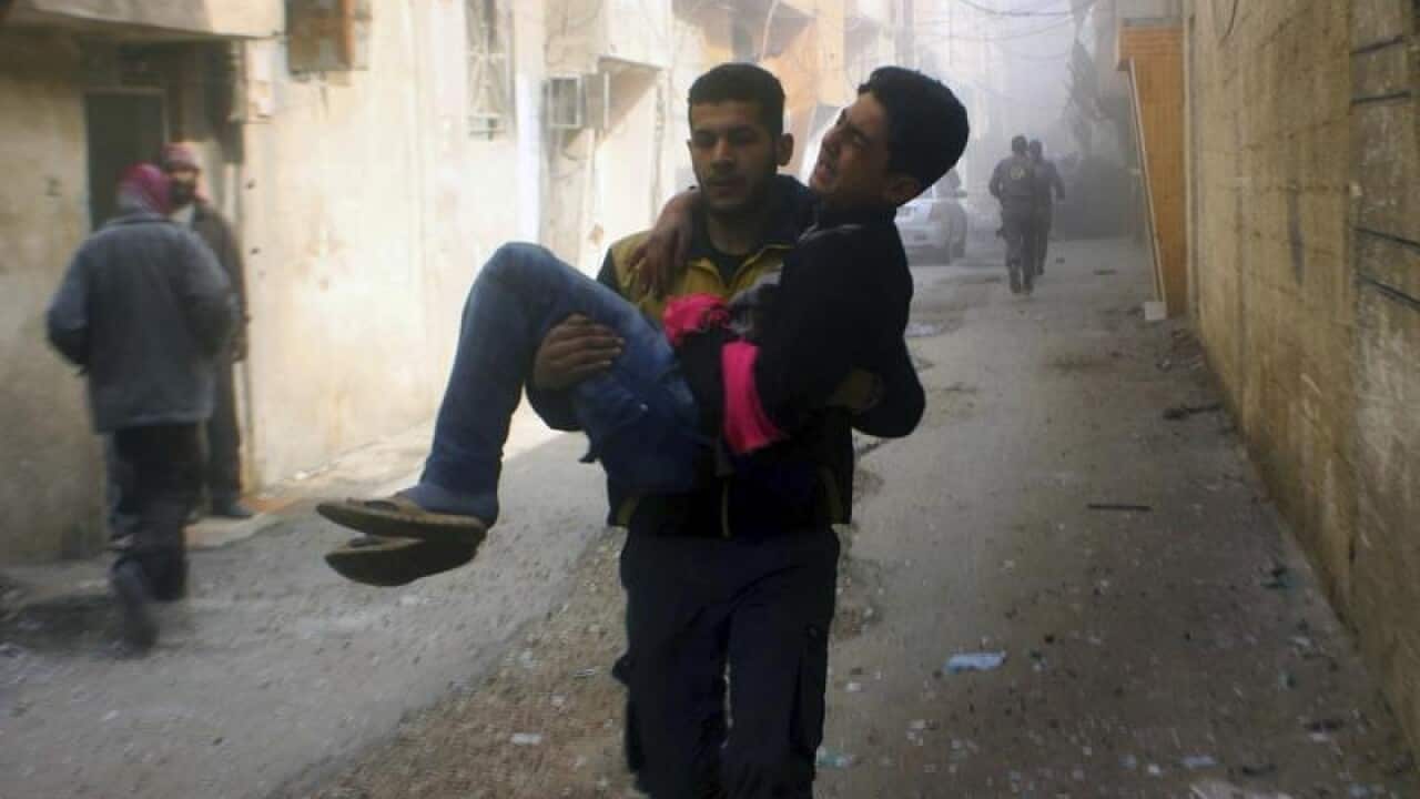 A young man injured in an airstrike on Syria's Ghouta.