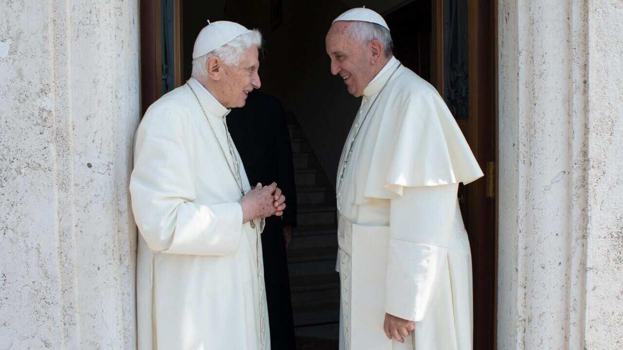 Pope Francis (R) meeting Pope Emeritus Benedict XVI at Vatican City in 2015 (AAP).