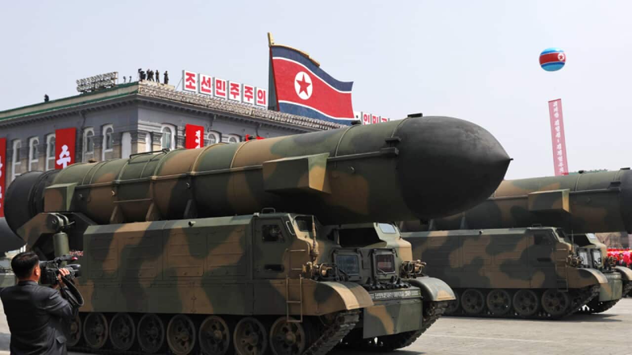 North Korean military vehicles carrying missiles during a parade