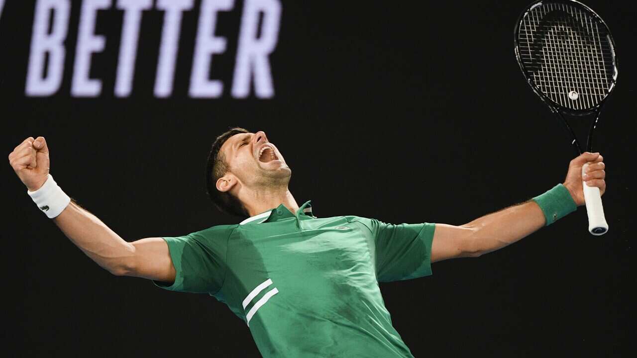 Serbia's Novak Djokovic celebrates after defeating United States' Talyor Fritz in their third round match at the Australian Open tennis championship in Melbourne, Australia, Saturday, Feb. 13, 2021.(AP Photo/Andy Brownbill)