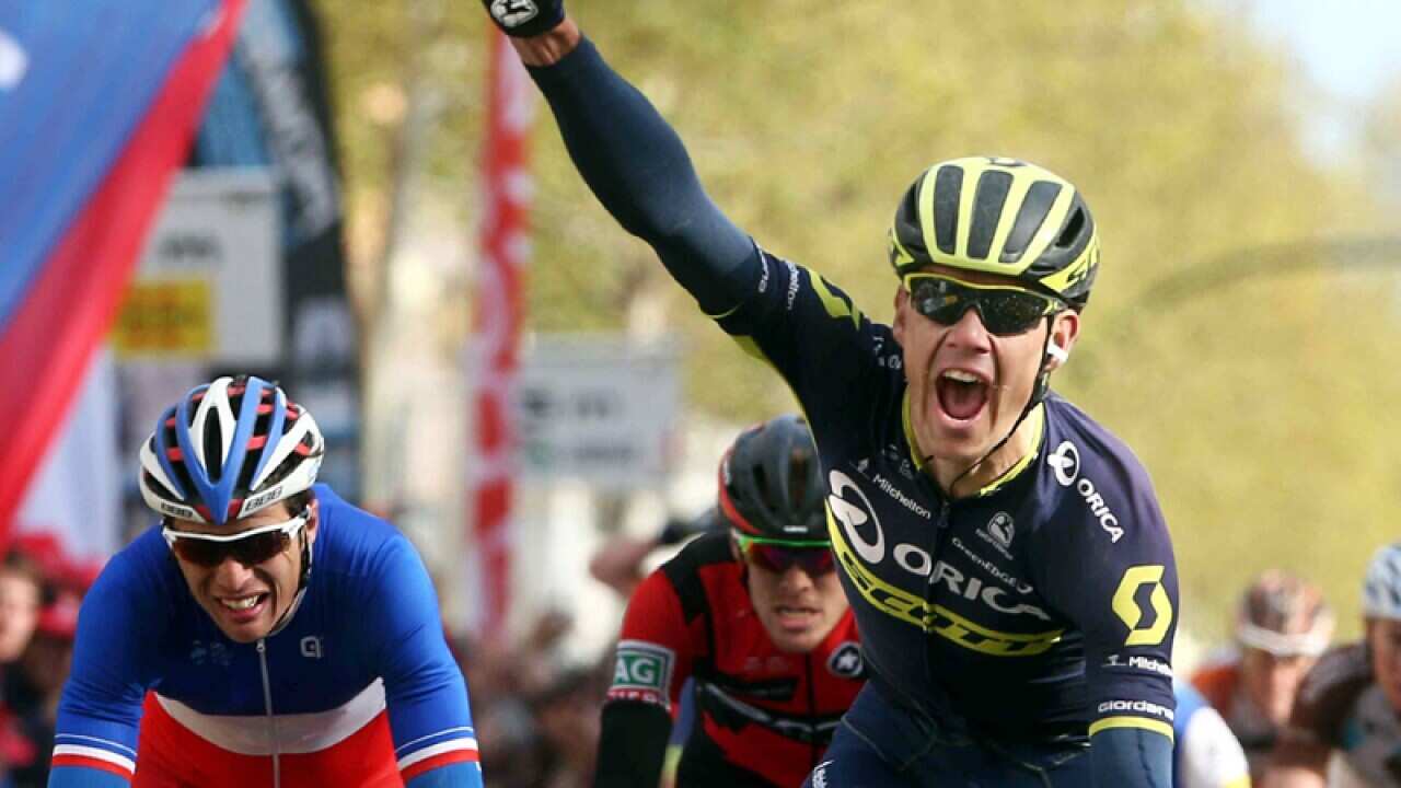 South African rider Daryl Impey (R) of the Orica-Scott team celebrates