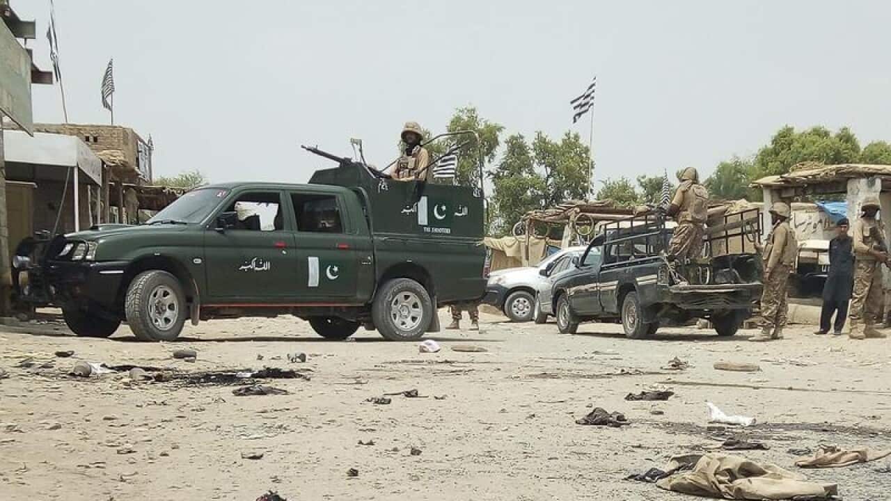 Troops guard the scene of a suicide attack in Bannu.