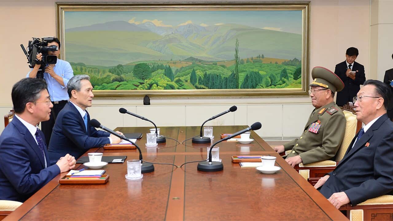South Korean Unification Minister Hong Yong-pyo, left, and National Security Director, Kim Kwan-jin, second from left, meet with Kim Yang Gon, right, a senior North Korean official responsible for South Korean affairs, and Hwang Pyong So, North Korean Mil