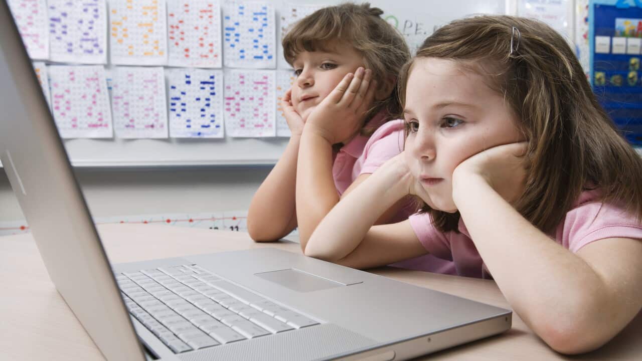 Girls using a laptop (AAP)