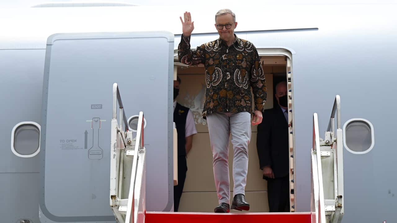 Australian Prime Minister Anthony Albanese waves on arrival in Makassar, Indonesia.