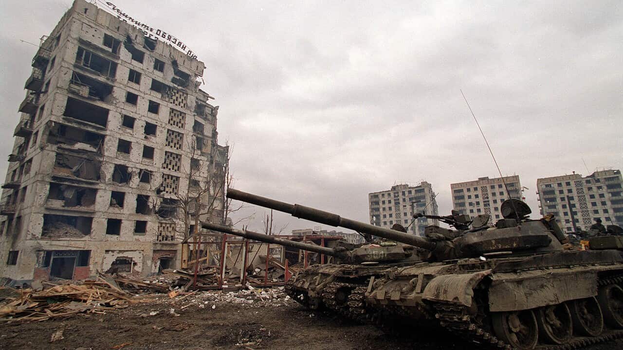 Russian tanks in the ruined capital of Grozny in February 2000.