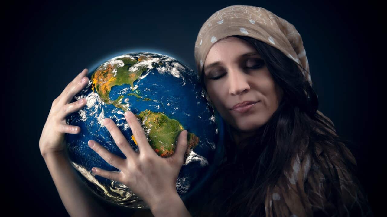 Woman hugging globe
