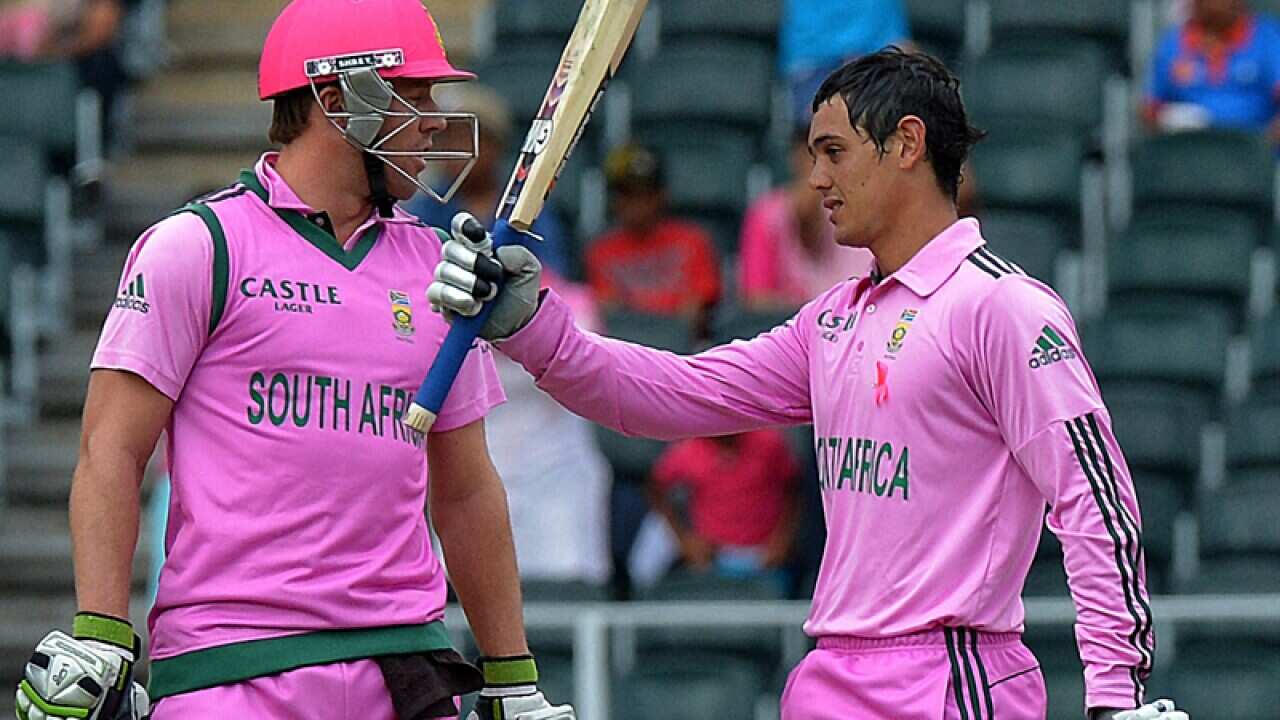 South Africa batsman Quinton de Kock (R) celebrates a century