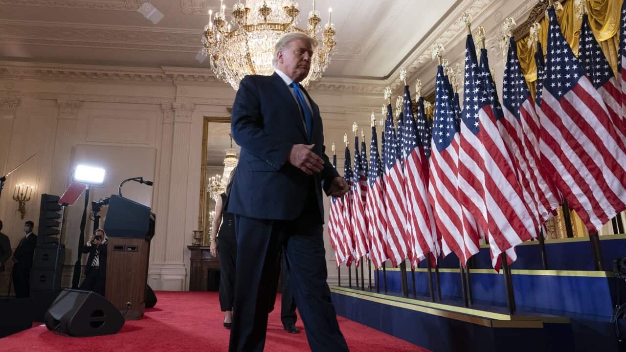 United States President Donald J. Trump departs after making a statement to the nation as his supporters look on in the East Room of the White House in Washington, DC on Election Night, Wednesday, November 4, 2020.Credit: Chris Kleponis / Pool via CNP .