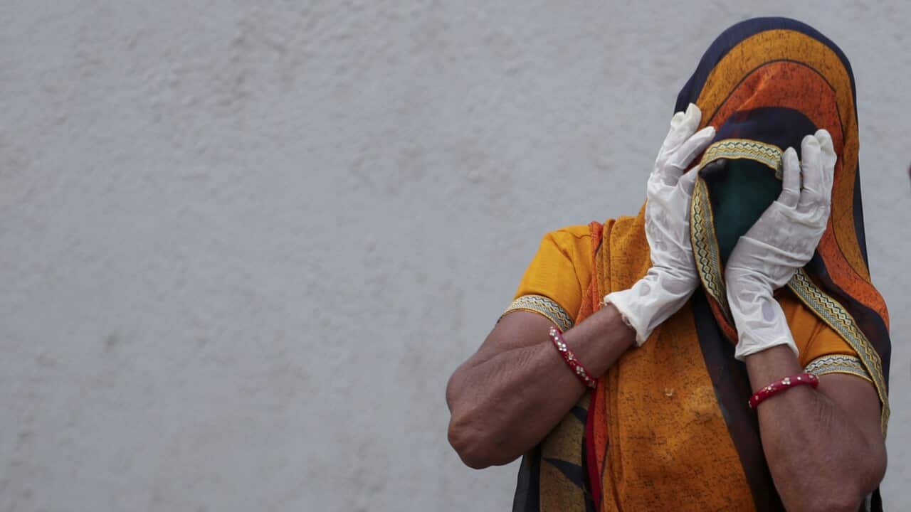 A relative of a patient who died of COVID-19, mourns outside a government COVID-19 hospital in Ahmedabad, India, Tuesday, April 27, 2021. Coronavirus cases in India are surging faster than anywhere else in the world. (AP Photo/Ajit Solanki)