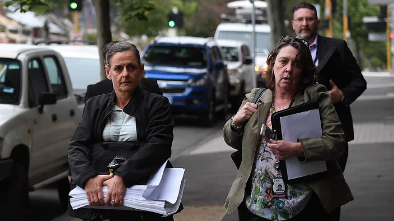 Federal police officers arrive at the offices of the Victorian brach of the AWU in west Melbourne.