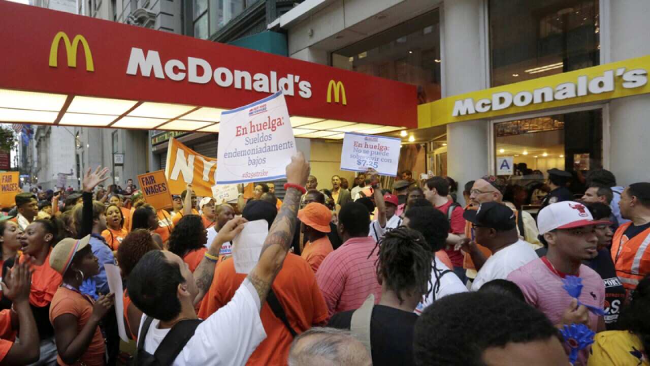 Protesters outside a McDonald's restaurant on New York's Fifth Avenue
