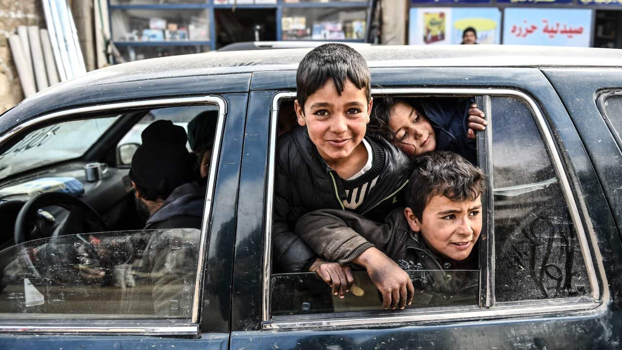 Civilians flee from Idlib toward the north to find safety inside Syria near the border with Turkey, Saturday, Feb. 15, 2020. Syrian troops are waging an offensive in the last rebel stronghold. (AP Photo)