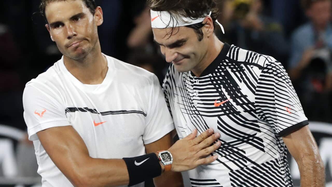 Roger Federer, right, is congratulated by Rafael Nadal