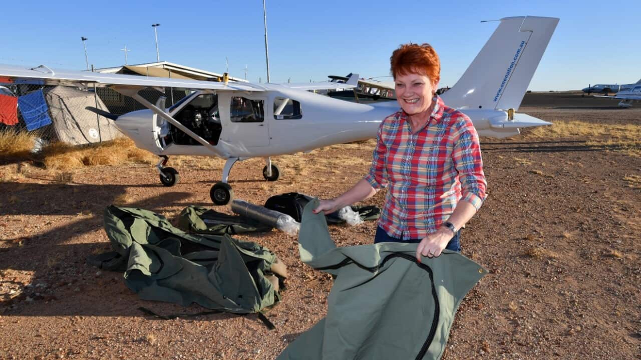 One Nation leader, Senator Pauline Hanson sets up camp in Birdsville next to the light plane which she travelled in on Thursday, August 31, 2017