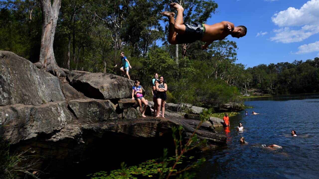 People cool off in Lake Parramatta in Sydney's west