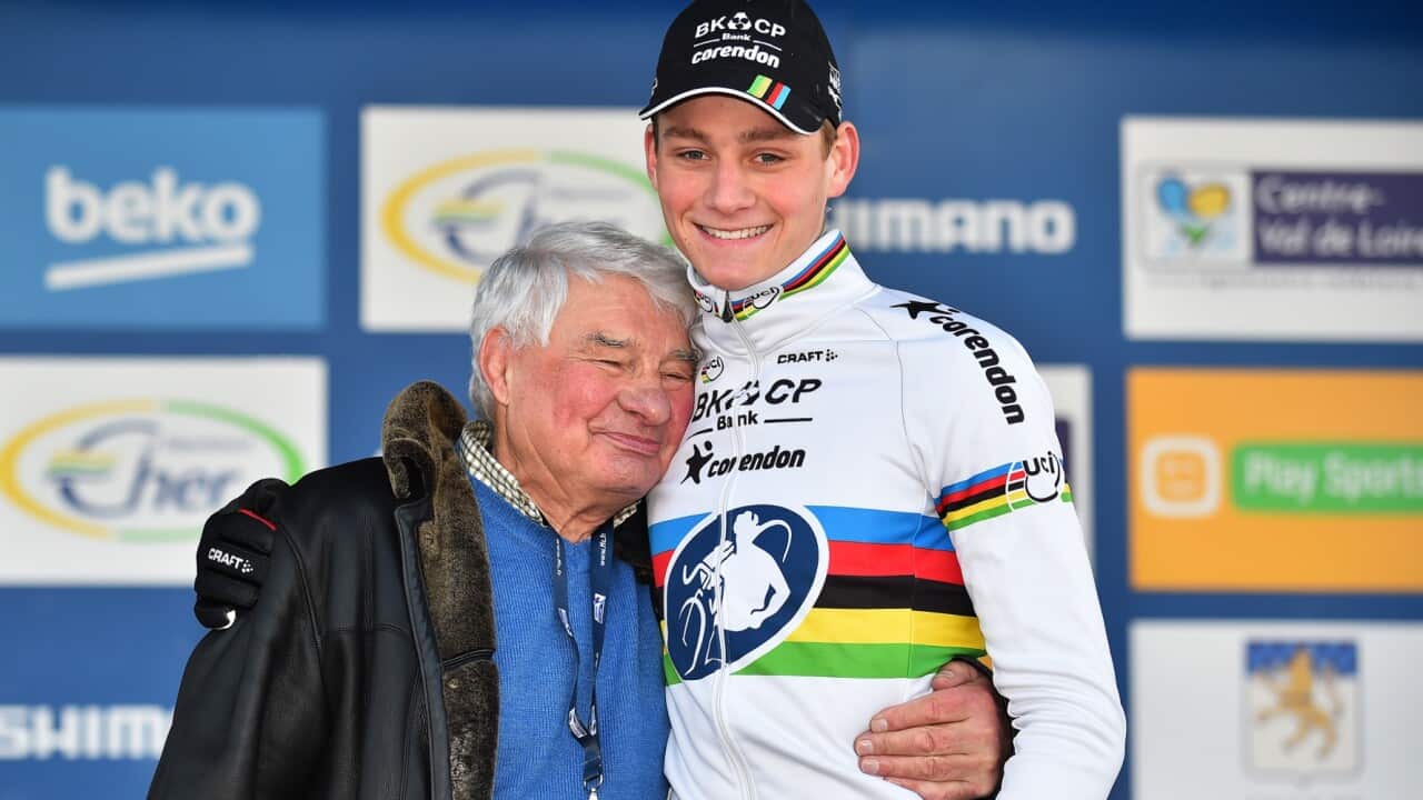 Raymond Poulidor (L) hugs grandson Mathieu van der Poel at the UCI Cyclo-cross World Cup Lignières-en-Berry in 2016.