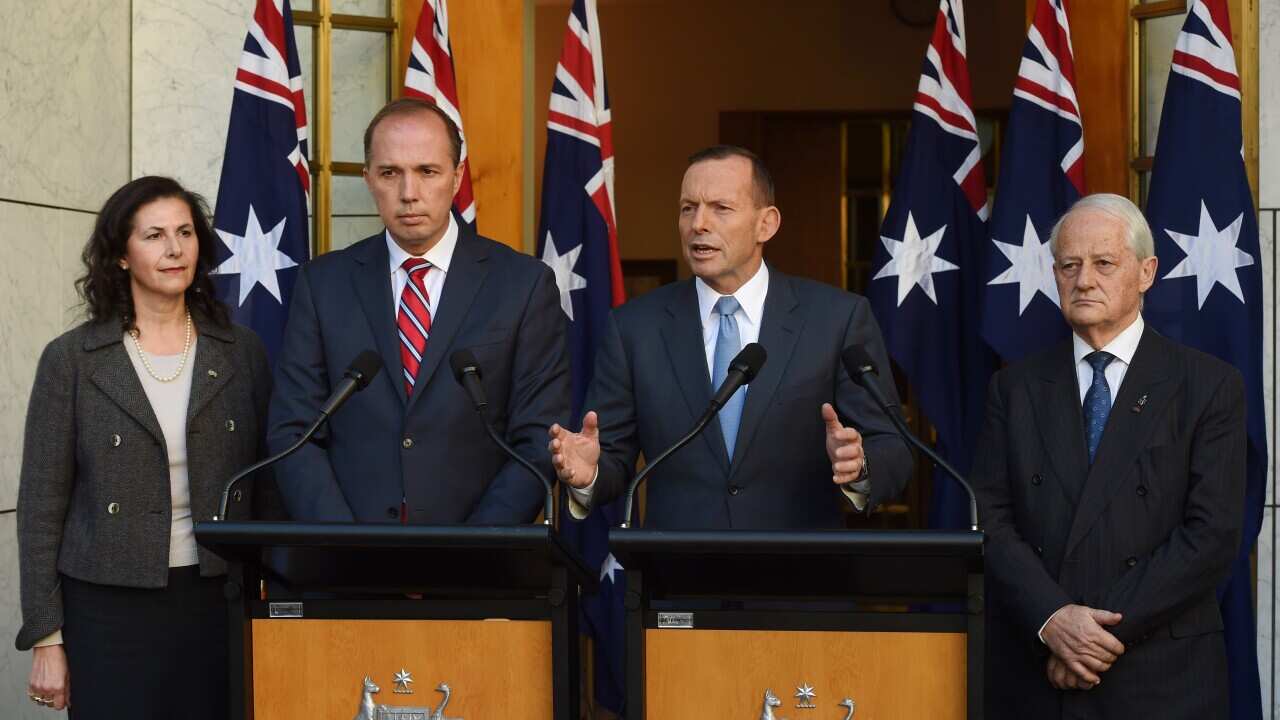 (L-R) Senator Concetta Fierravanti-Wells, Immigration minister Peter Dutton, Prime Minister Tony Abbott and Philip Ruddock at Parliament House in Canberra