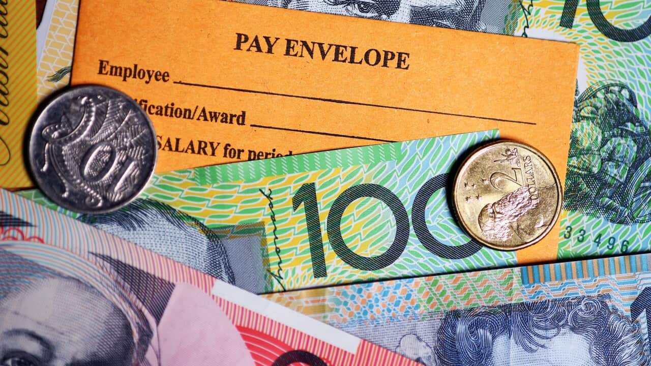 A stock photograph of Australian currency and a wages envelope.