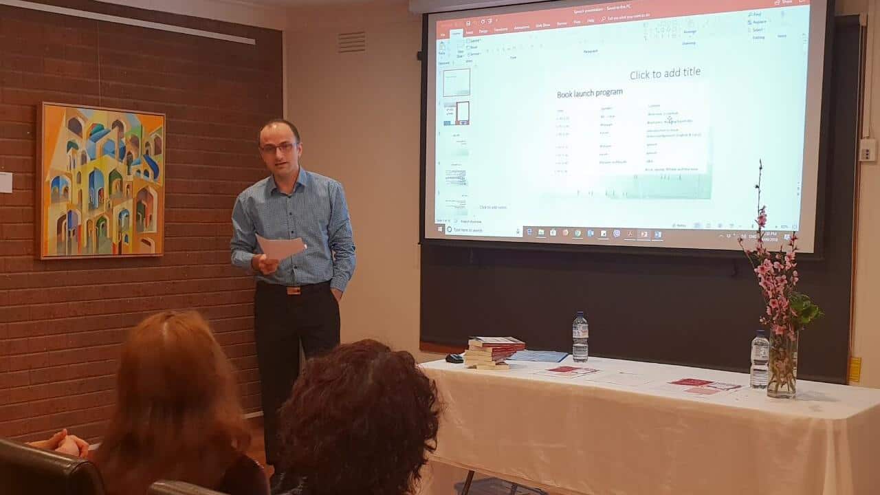 Dr. Kawa Bewrani presenting at a book launch