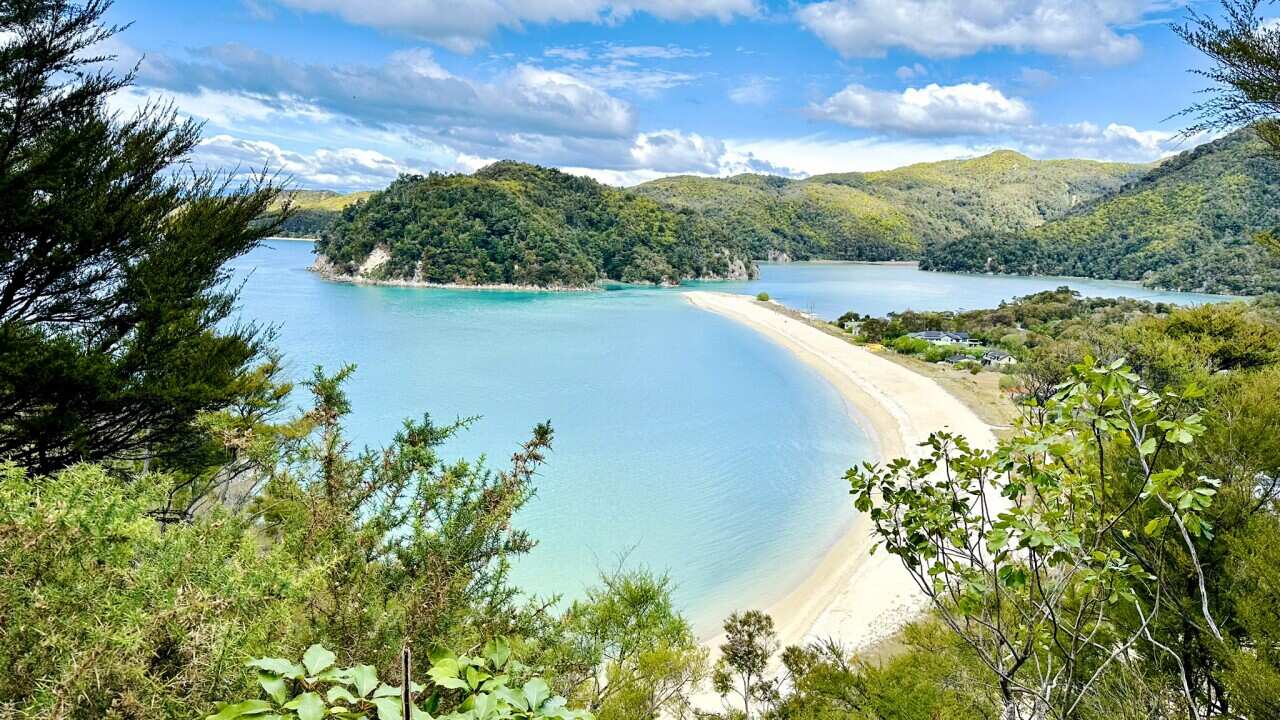 Landscape view of turquoise blue waters of the Torrent Bay on a summer blue day overlooking the Torrent village.