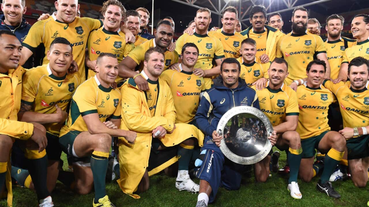 Wallabies players with the Nelson Mandela trophy
