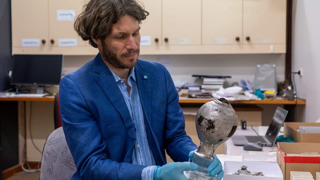 Arvi Wattel examining Batavia silver (Supplied Credit Jarryd Gardner).jpg