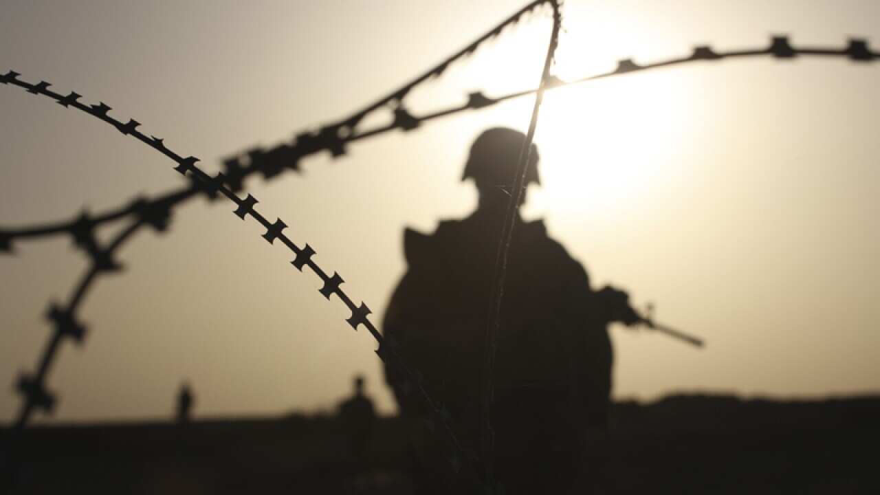 A soldier on patrol in the Helmand province