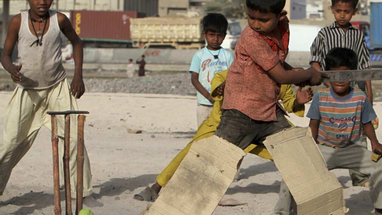 boys are all togged up to play cricket