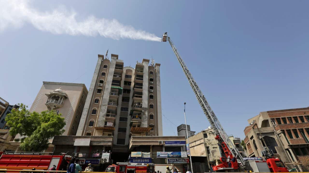 Indian firefighters use hydraulic platform to sanitise an area during a nationwide lockdown to curb the spread of coronavirus in Ahmedabad, India.