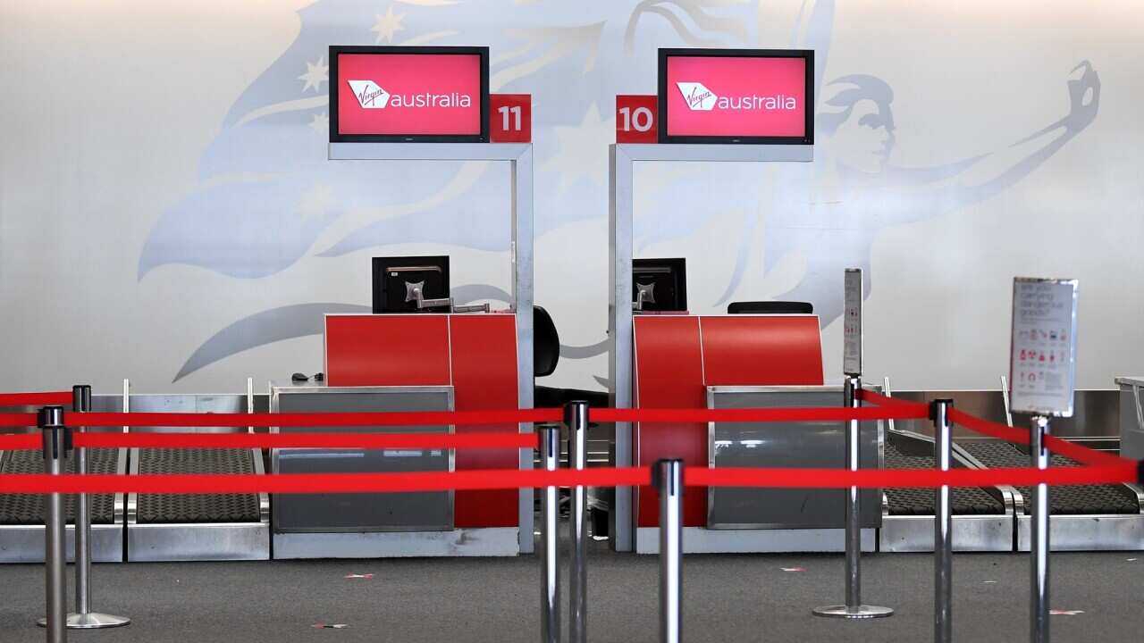 An empty Virgin Australia check-in area at Brisbane domestic airport