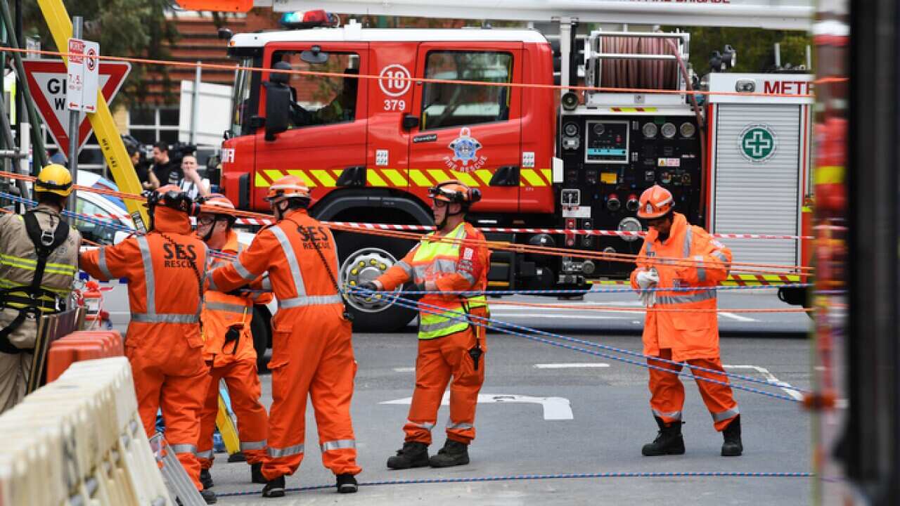 Emergency service workers are seen at the scene of an accident